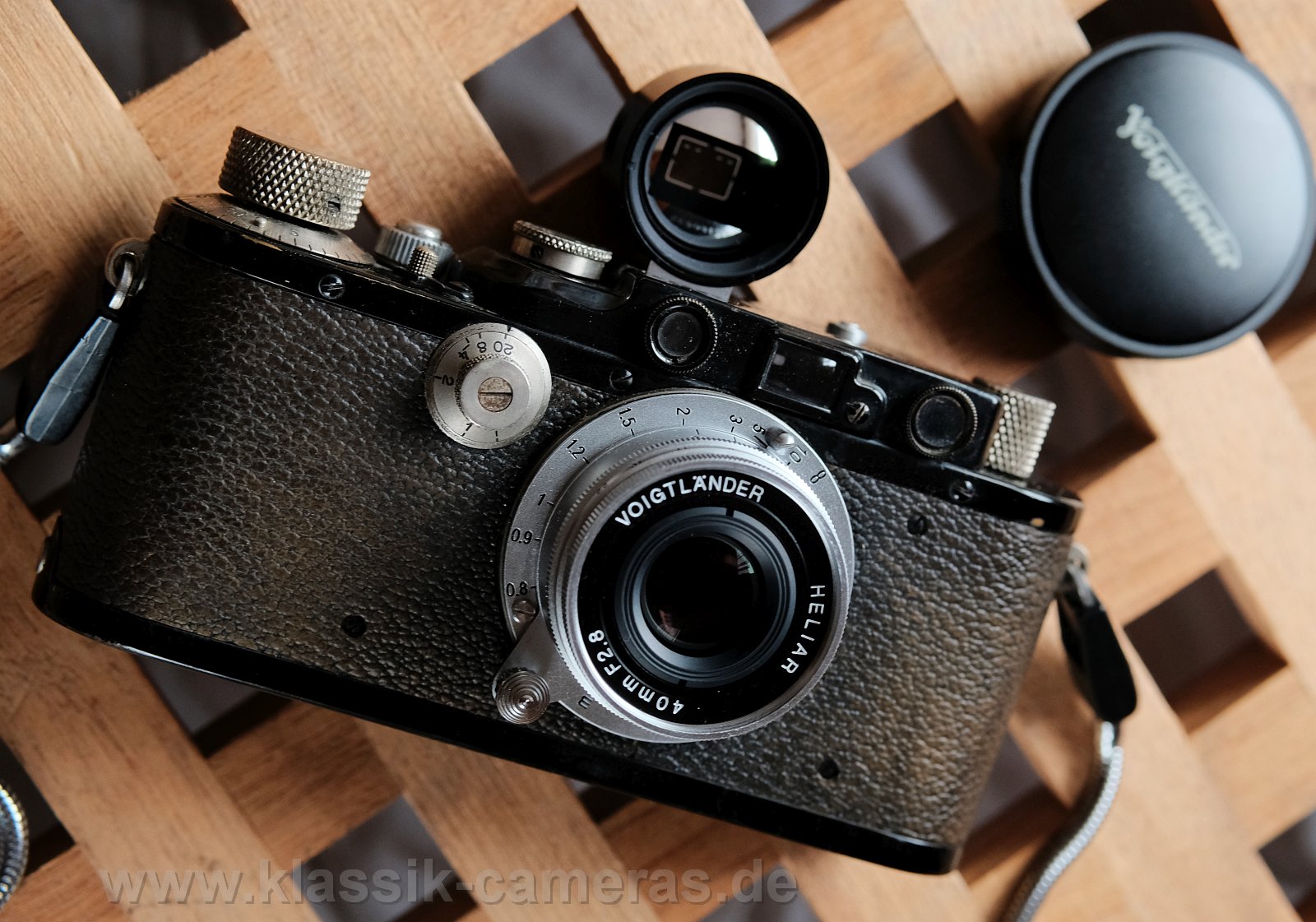 Leica III /1933 w.
          Voigtlander Heliar 40/2.8 and "M" 40mm finder